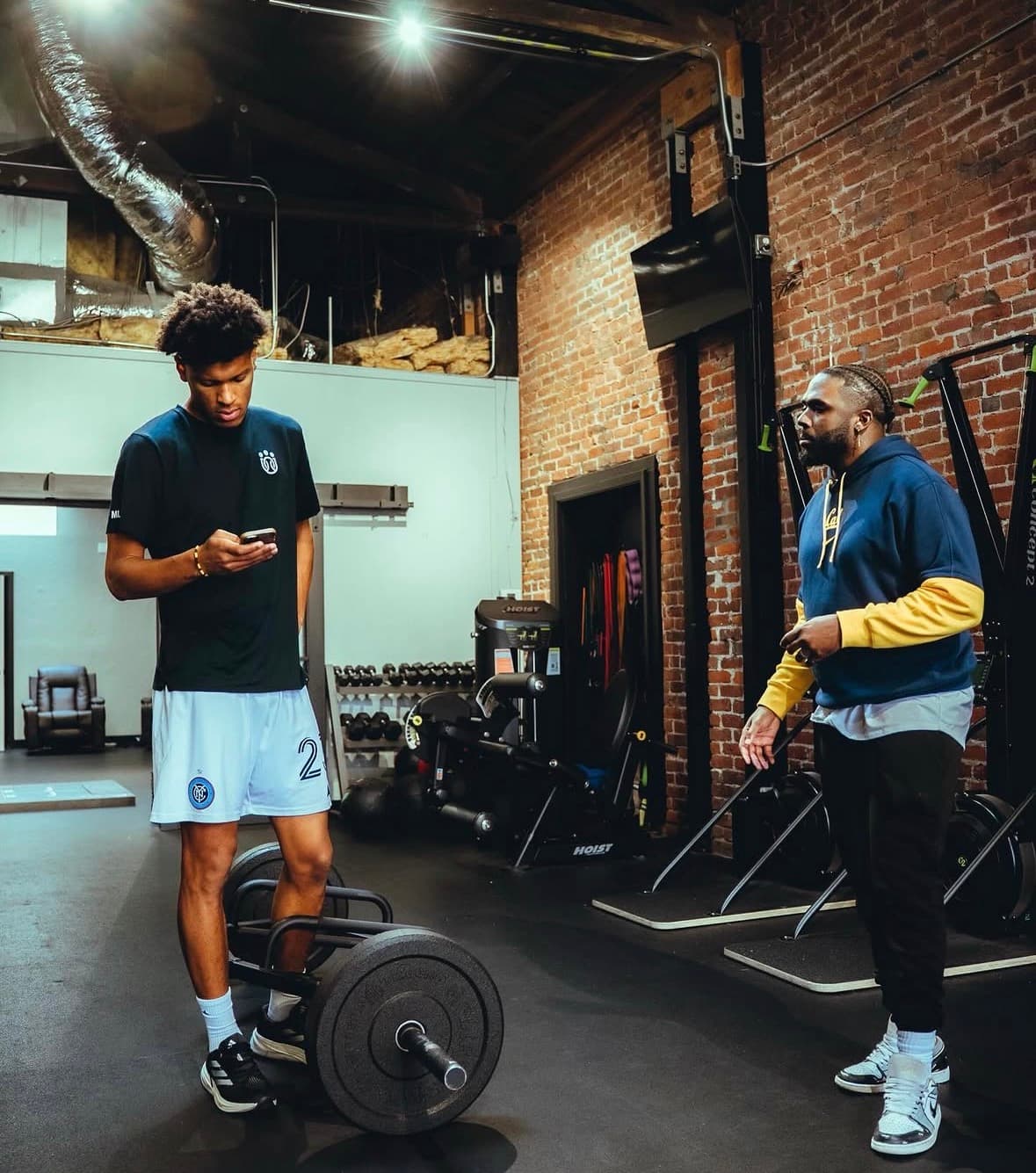 Basketball player with coach