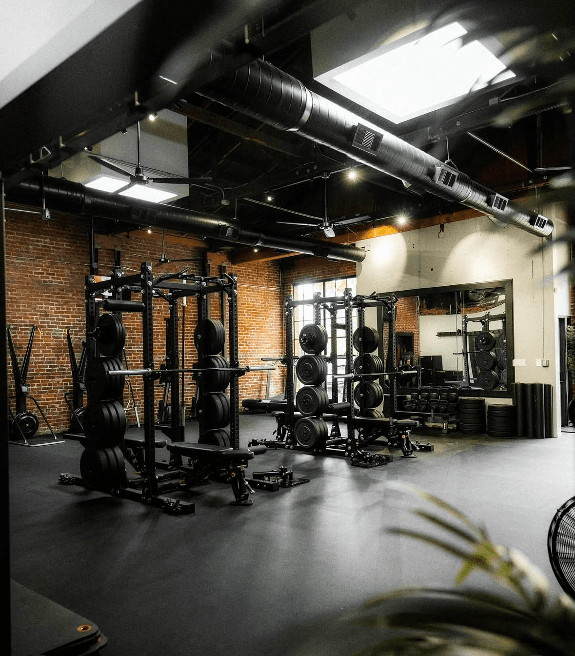 G6 Performance Sacramento flagship gym floor with squat racks at 911 20th Street in Midtown